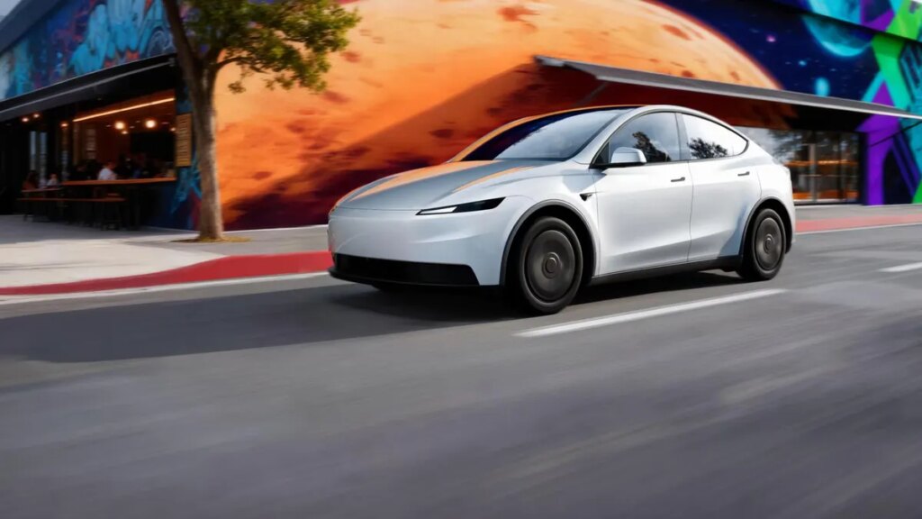 Here’s How Much Tesla’s New Range of Affordable Electric Cars Cost Tesla Model Y Standard model in white driving on a road in LA