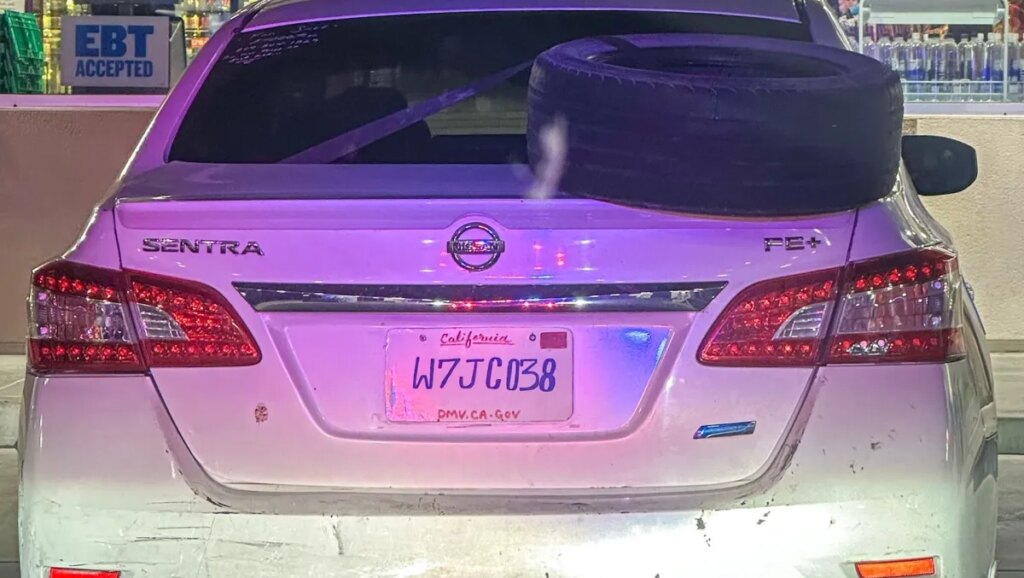 The Artist Behind This Nissan's Homemade License Plate Did Their Best, But Still Got Caught