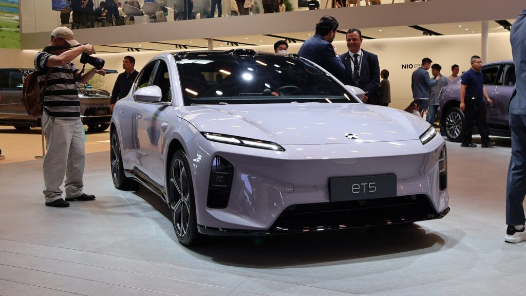 Nio’s William Li warns of China auto sales drop while backing own growth A Nio ET5 on display at the Beijing Auto Show in April 2026.