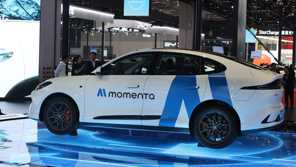 China resumes issuing robotaxi licenses after months-long freeze, report says A Momenta robotaxi on display at the Shanghai Auto Show in April 2025.