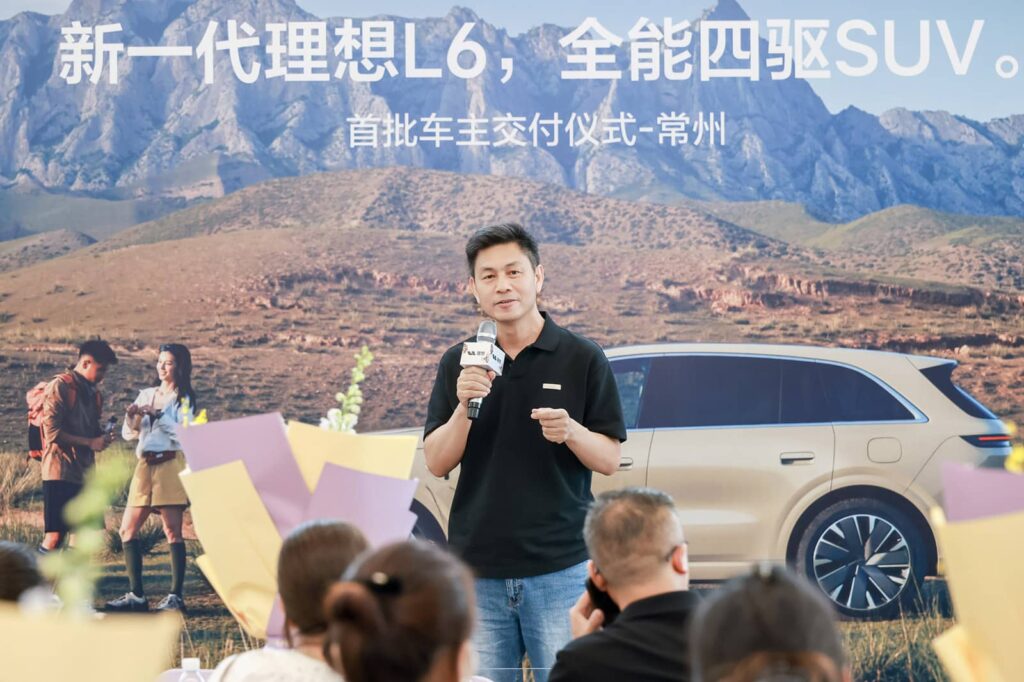 Li Bin, head of manufacturing at Li Auto, spoke at a delivery ceremony for the updated Li L6 in Changzhou, Jiangsu.