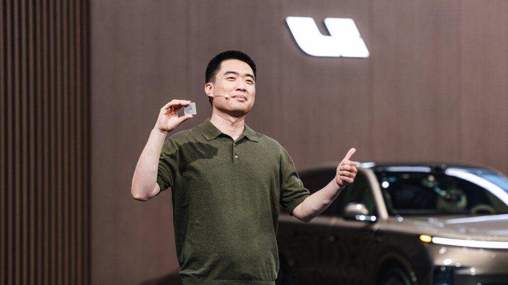 Li Auto sets up chip company, echoing Nio’s spin-off playbook Li Xiang, founder, chairman, and CEO of Li Auto, showcases the Mach M100 chip at Li Auto’s Livis Day in June 2026.