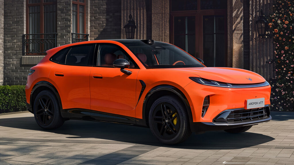 Orange Arcfox Alpha T7 shown from the front three-quarter angle, featuring black wheels and yellow brake calipers.