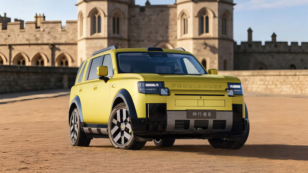 Yellow Freelander 8 SUV shown from the front three-quarter angle in front of a historic stone building.