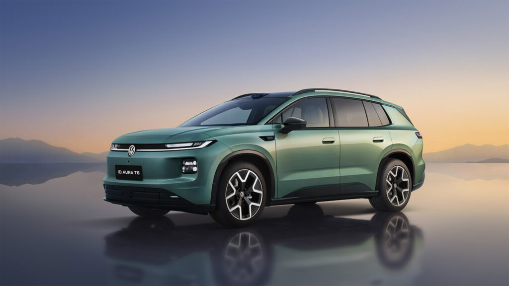 Green FAW-Volkswagen ID. AURA T6 electric SUV shown from a front three-quarter angle against a sunset landscape.