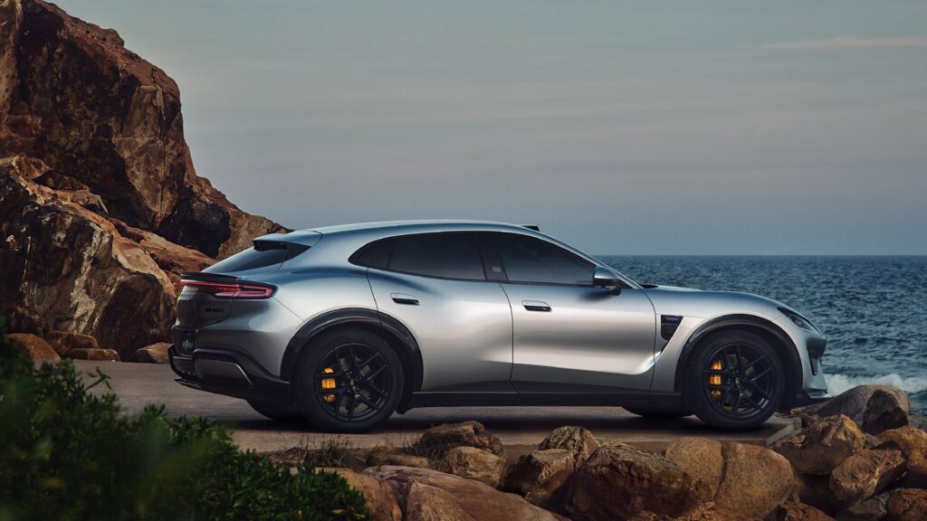 Luxeed RX to open pre-orders on August 20 with 4 LiDAR sensors Luxeed RX parked on a coastal road beside rocky cliffs and the sea.