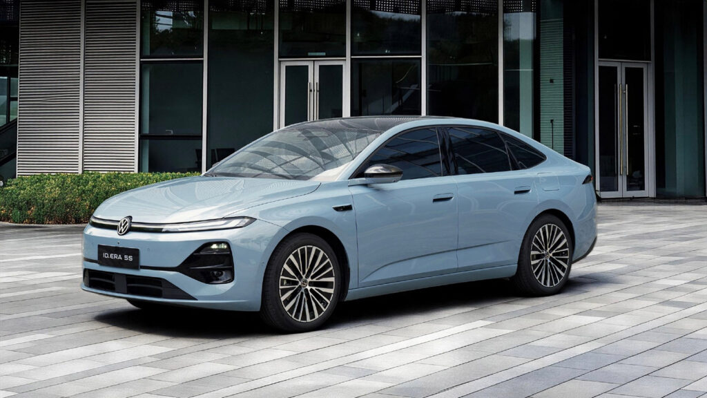 A light blue SAIC Volkswagen ID. ERA 5S plug-in hybrid sedan parked outside a modern building, shown from the front three-quarter angle.