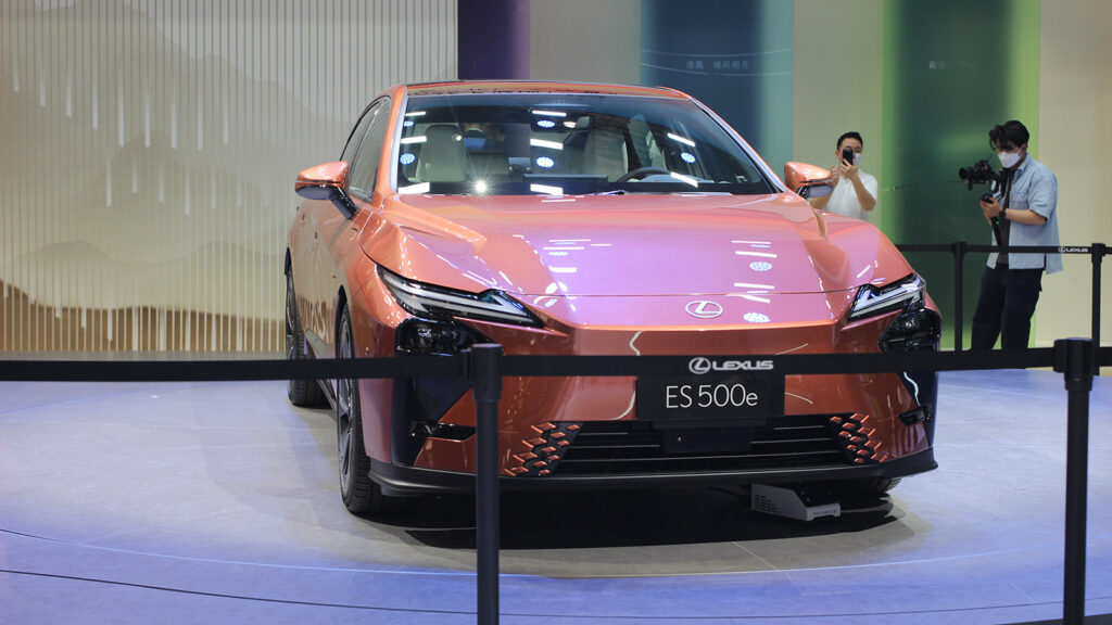 Front view of a copper-colored Lexus ES 500e on display at the 2025 Shanghai Auto Show.