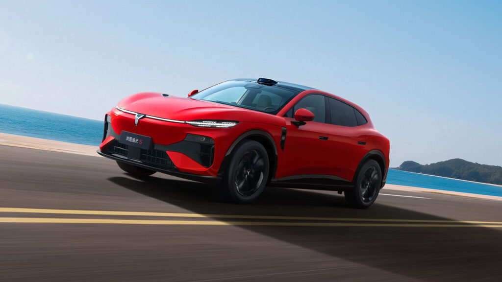 Red Voyah Passion S driving on a road, shown from the front three-quarter angle.