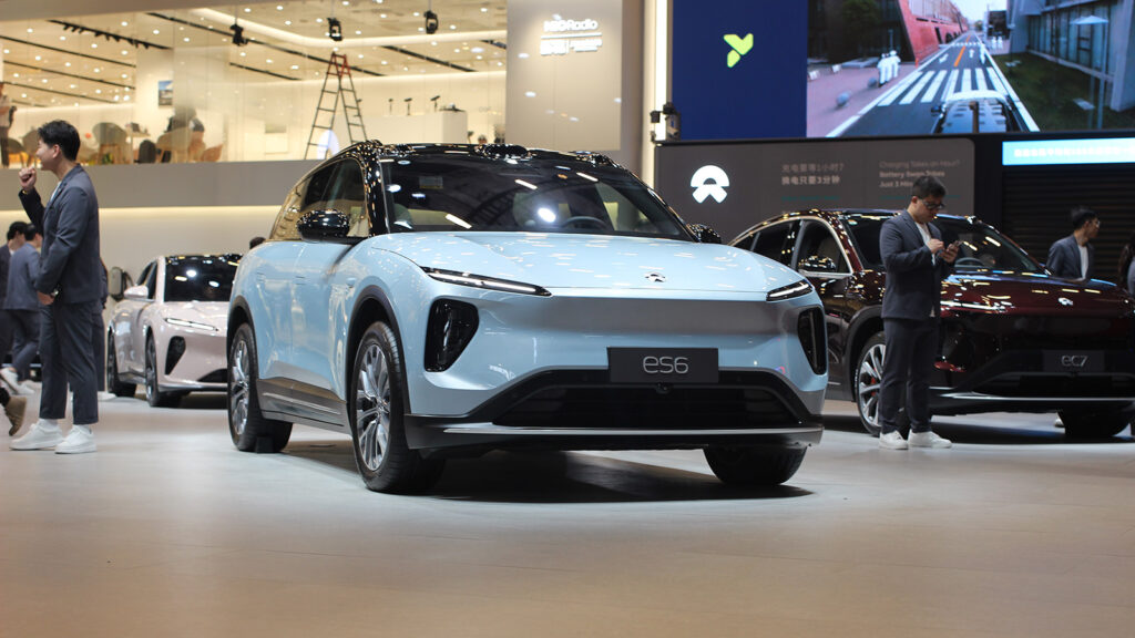 Light blue Nio ES6 electric SUV displayed at the Shanghai Auto Show in April 2025, viewed from the front at an angle.