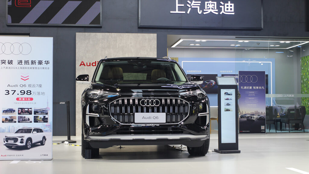 Audi to shift 4-ring business to FAW as SAIC focuses on AUDI, report says Front view of a black Audi Q6 SUV at the SAIC Audi booth at a new energy vehicle show in Shanghai in June 2024.