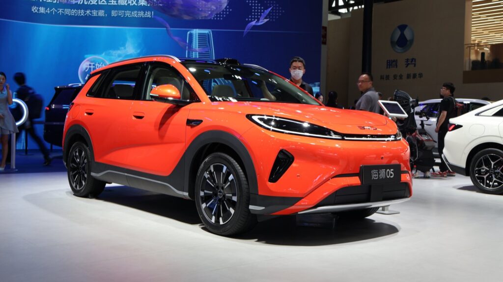Orange BYD Sealion 05 SUV viewed from the front three-quarter angle at the Beijing Auto Show in April 2026.