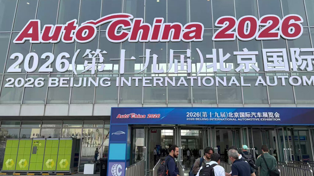 Beijing Auto Show to return in March 2027 as full-scale events keep alternating with Shanghai Visitors outside an entrance to the 2026 Beijing Auto Show beneath large Auto China 2026 signage.