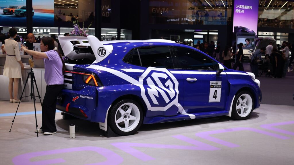 Blue MG hatchback with white racing graphics, white wheels and a large rear wing on display at the Beijing Auto Show in April 2026.