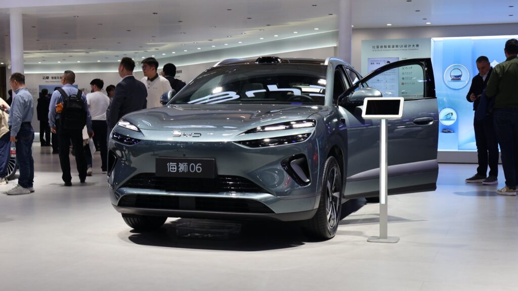 A gray BYD Sealion 06 SUV with a front door open on display at the Beijing Auto Show in April 2026.