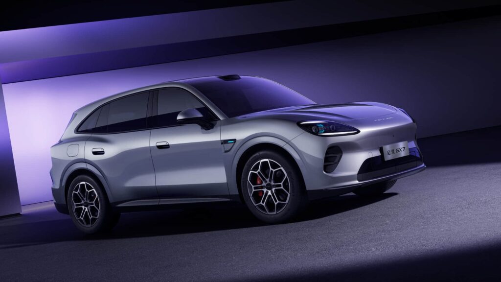 Silver Aistaland GX7 SUV shown from a front three-quarter angle under purple studio lighting.
