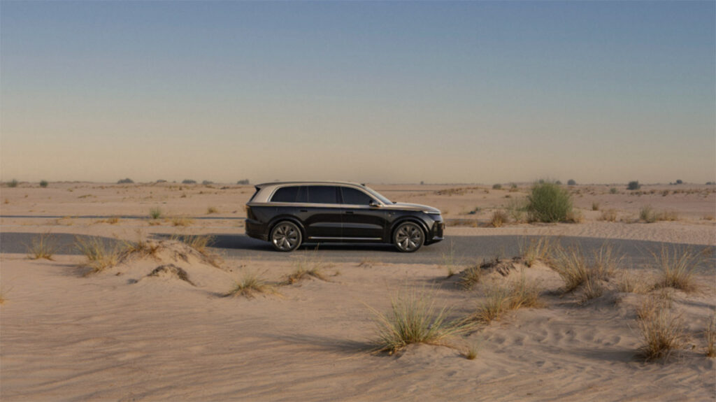 Li Auto launches new L9 in UAE in key Middle East expansion step A black Li L9 traveling on a paved road through a desert landscape in the UAE.