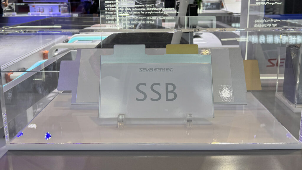 Sunwoda solid-state battery cell labeled “SSB” in a glass display case at the Shanghai Auto Show in April 2025.