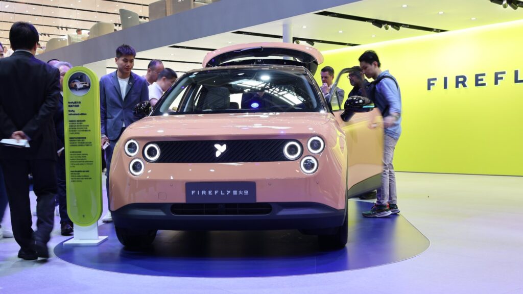 Nio recalls 686 Firefly EVs in China over steering safety risk Front view of a pink Firefly EV with circular headlights on display at the Beijing Auto Show in April 2026.
