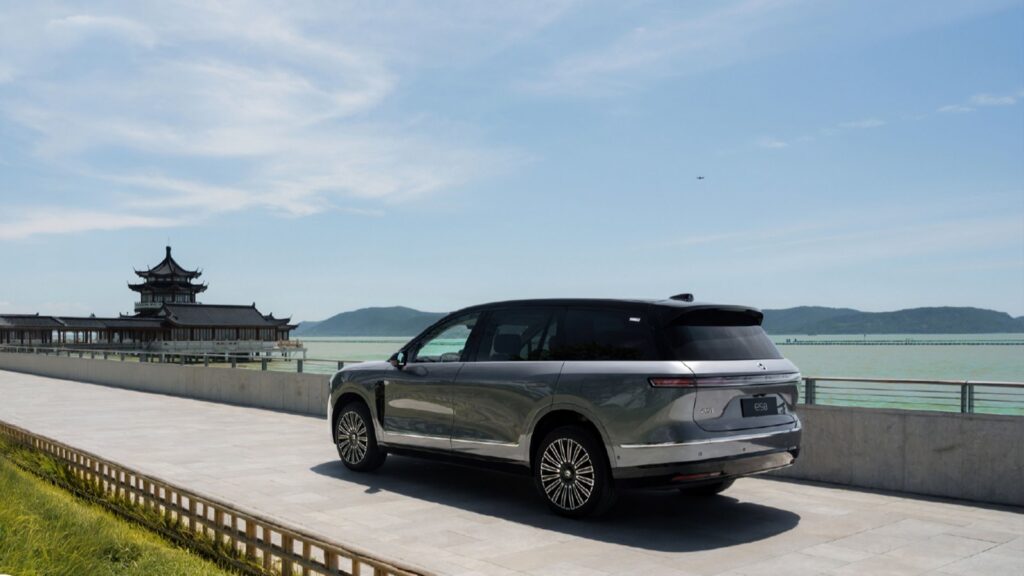 Nio to reach 150,000 deliveries of third-gen ES8 this week Rear three-quarter view of a gray third-generation Nio ES8 electric SUV by the water, with a traditional Chinese pavilion in the background.